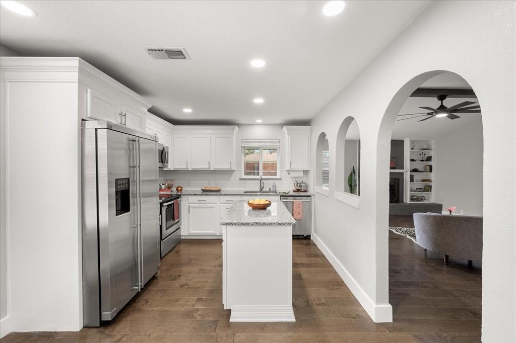 1405 Timberline Drive Benbrook, TX 76126 - Photo 6 of 26 a kitchen with refrigerator and cabinets