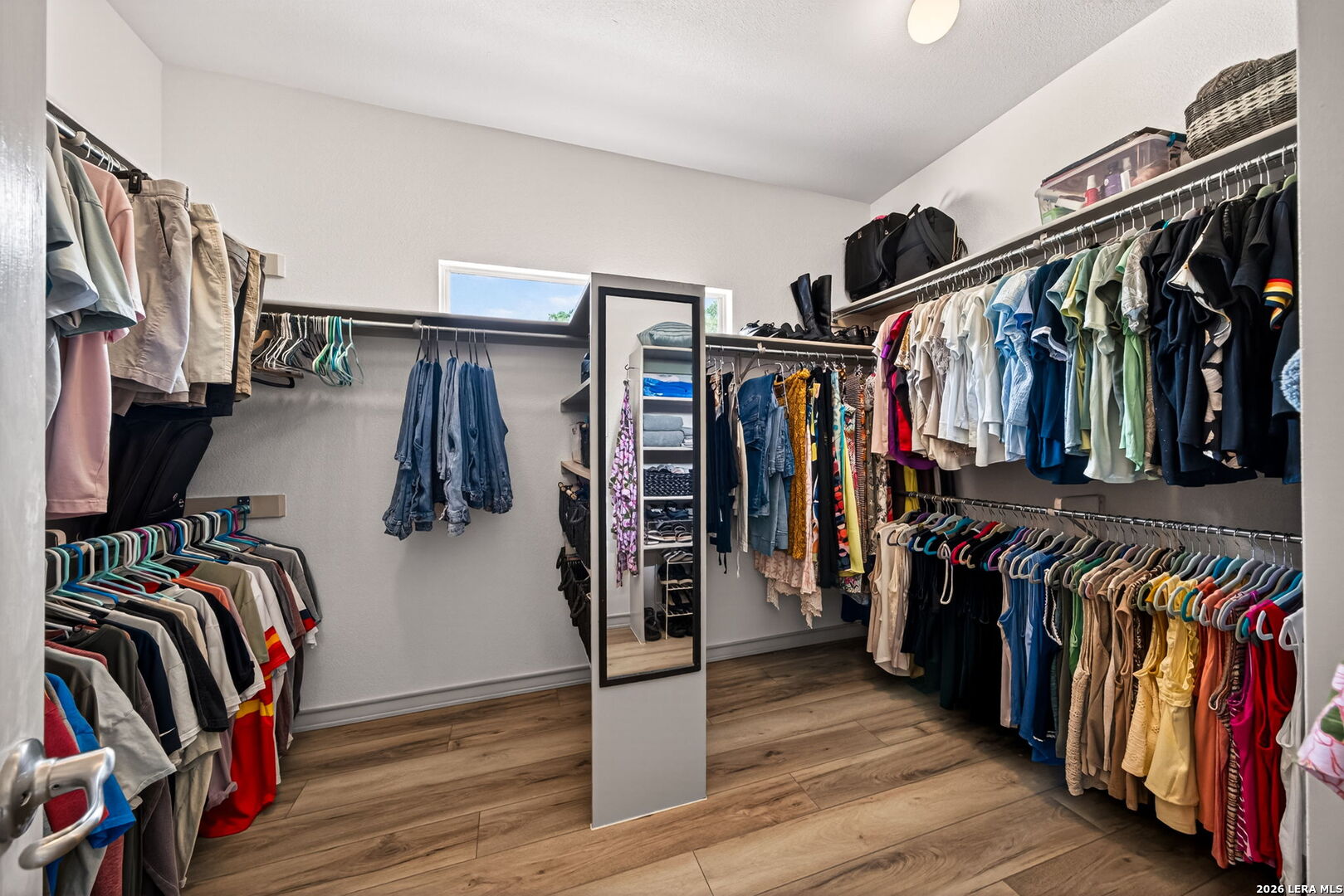 17431 Helotes Spring Road Helotes, TX 78023 - Photo 27 of 50 a view of walk in closet with clothes and shoes