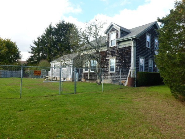 310 Bakerville Road Dartmouth, MA 02748 - Photo 2 of 19 a view of a house with a yard and sitting area