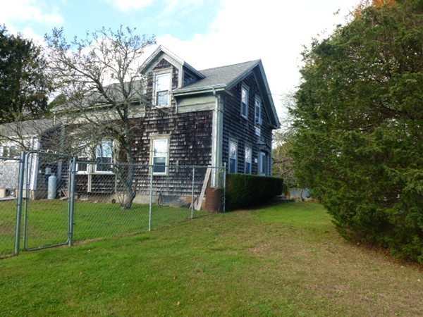 310 Bakerville Road Dartmouth, MA 02748 - Photo 4 of 19 a view of a house with a yard