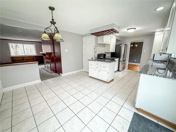a view of living room with furniture and flat screen tv