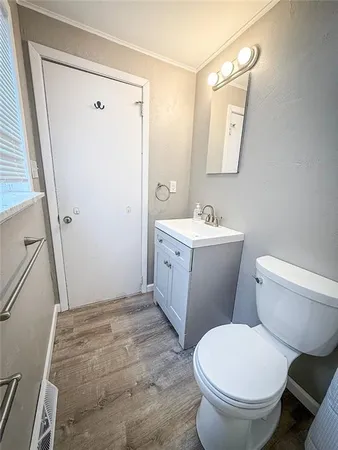 an empty room with furniture and a window
