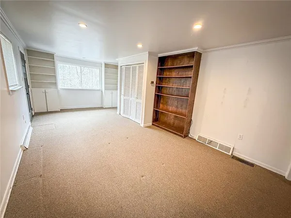 an empty room with windows