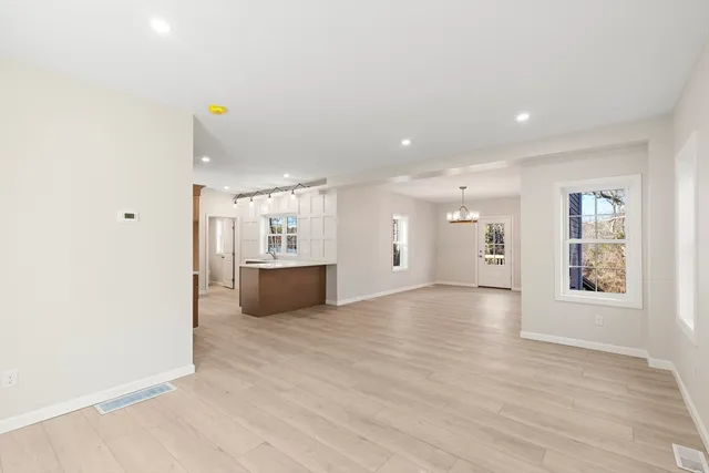 a view of a kitchen with a sink and a window