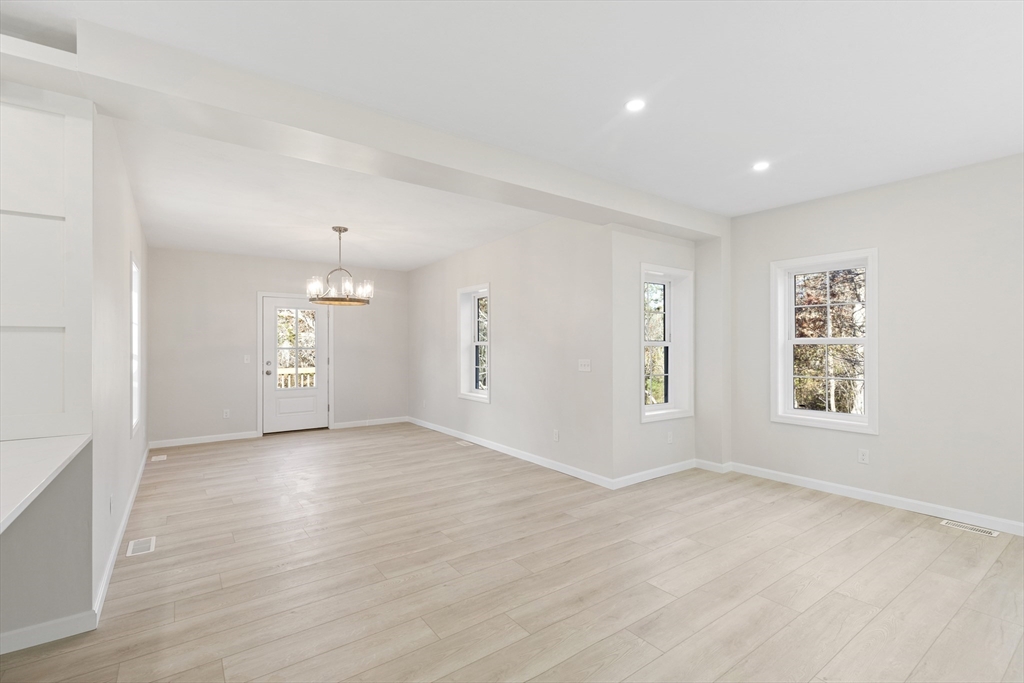 1234 State Road, Unit 1 Plymouth, MA 02360 - Photo 15 of 32 wooden floor in an empty room with a window