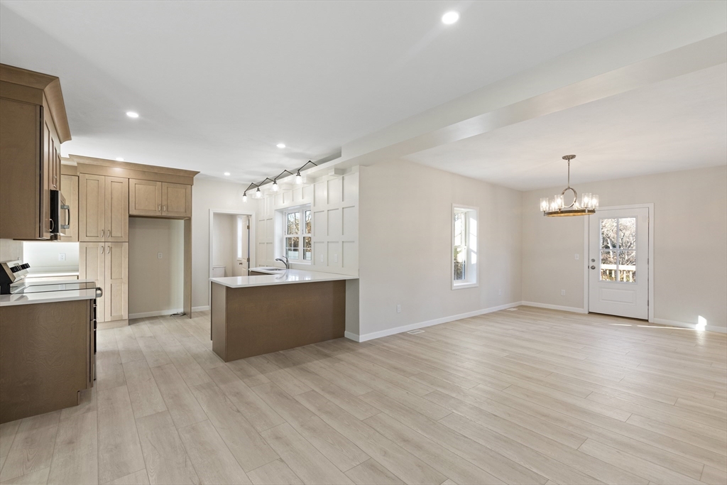 1234 State Road, Unit 1 Plymouth, MA 02360 - Photo 18 of 32 a view of kitchen with refrigerator stove and wooden floor