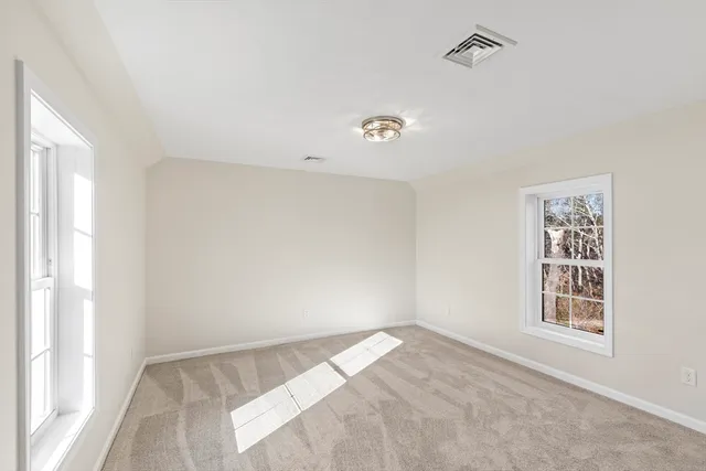 a view of an empty room and a window