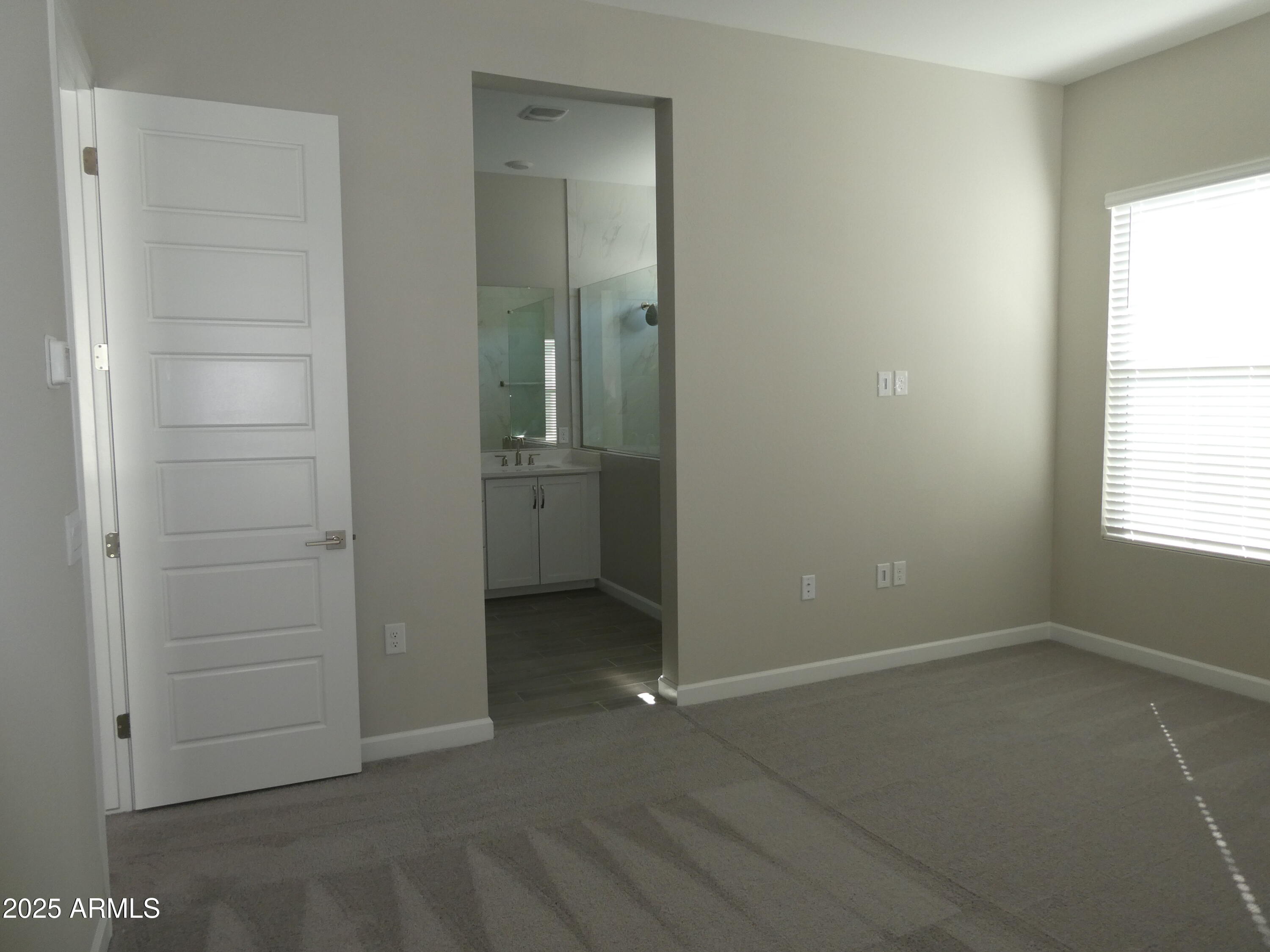 5027 Gallop Way Scottsdale, AZ 85254 - Photo 11 of 25 an empty room with windows and closet