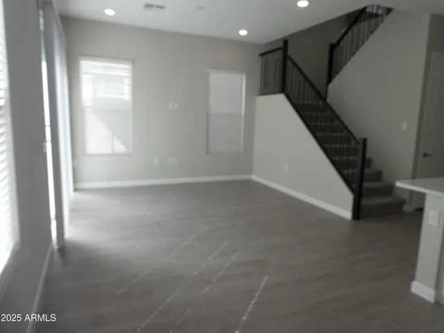a view of an empty room with stairs