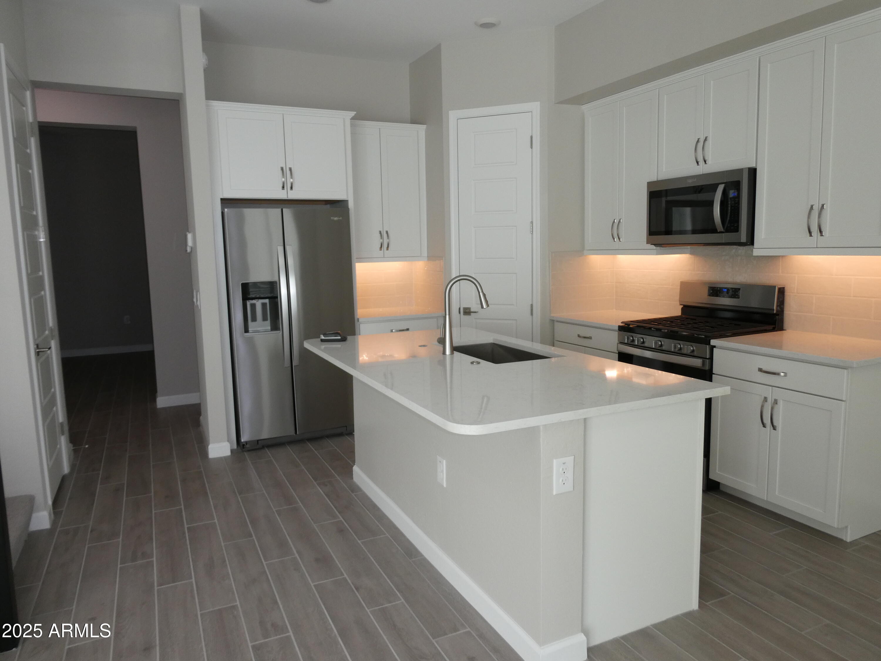 5027 Gallop Way Scottsdale, AZ 85254 - Photo 8 of 25 a kitchen with a refrigerator stove and microwave