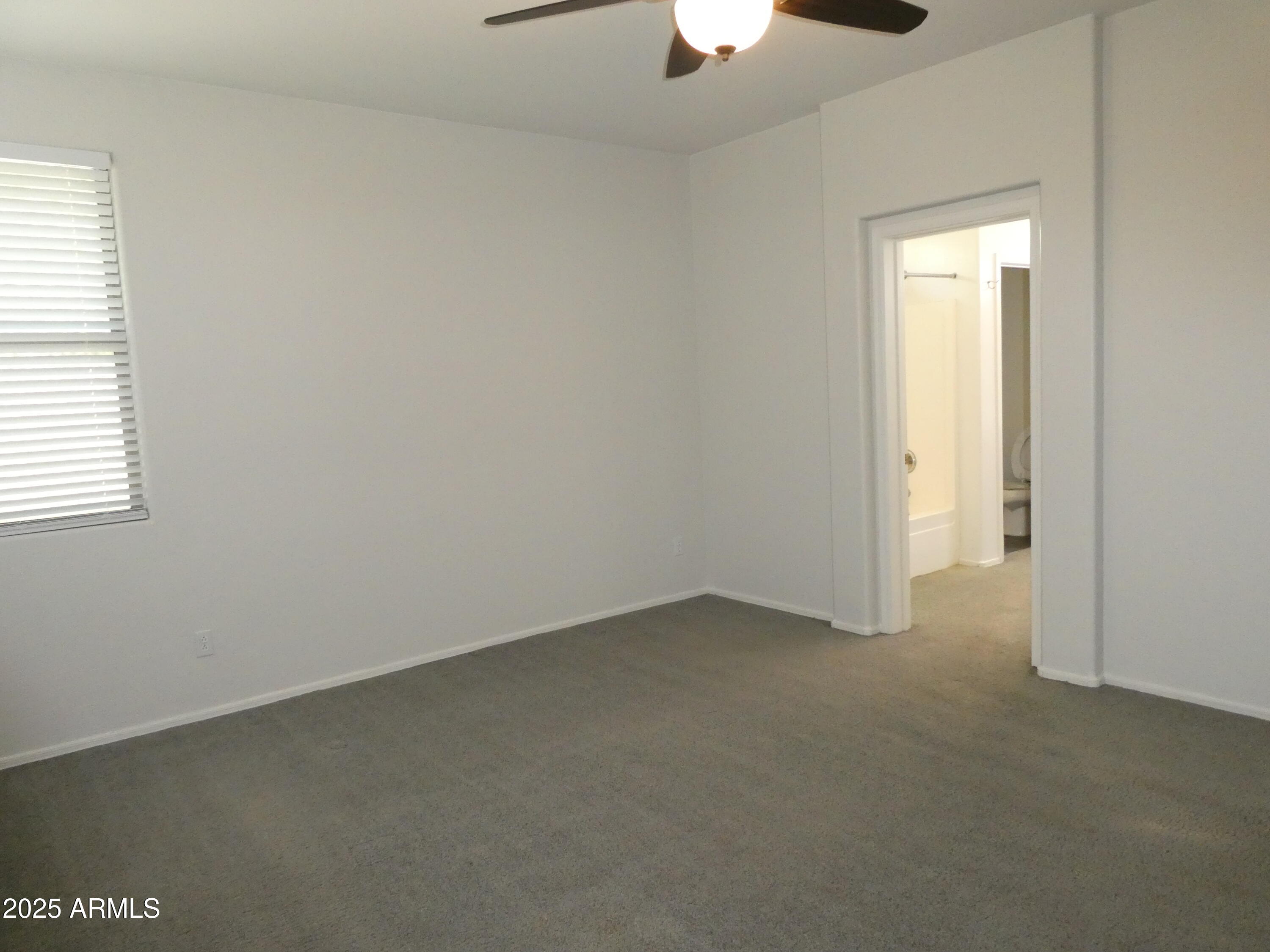 5027 Gallop Way Scottsdale, AZ 85254 - Photo 10 of 25 an empty room with a window
