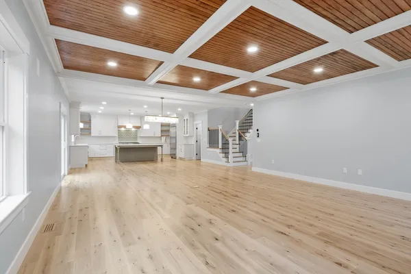 a view of a room with wooden floors