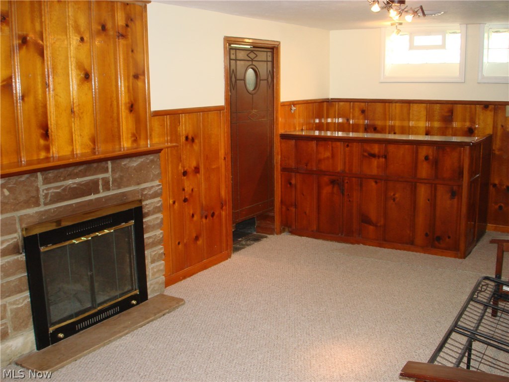 4803 Farnhurst Road Cleveland, OH 44124 - Photo 13 of 28 Partially finished basement offers a gorgeous homey family room with woodburning fireplace and bar!