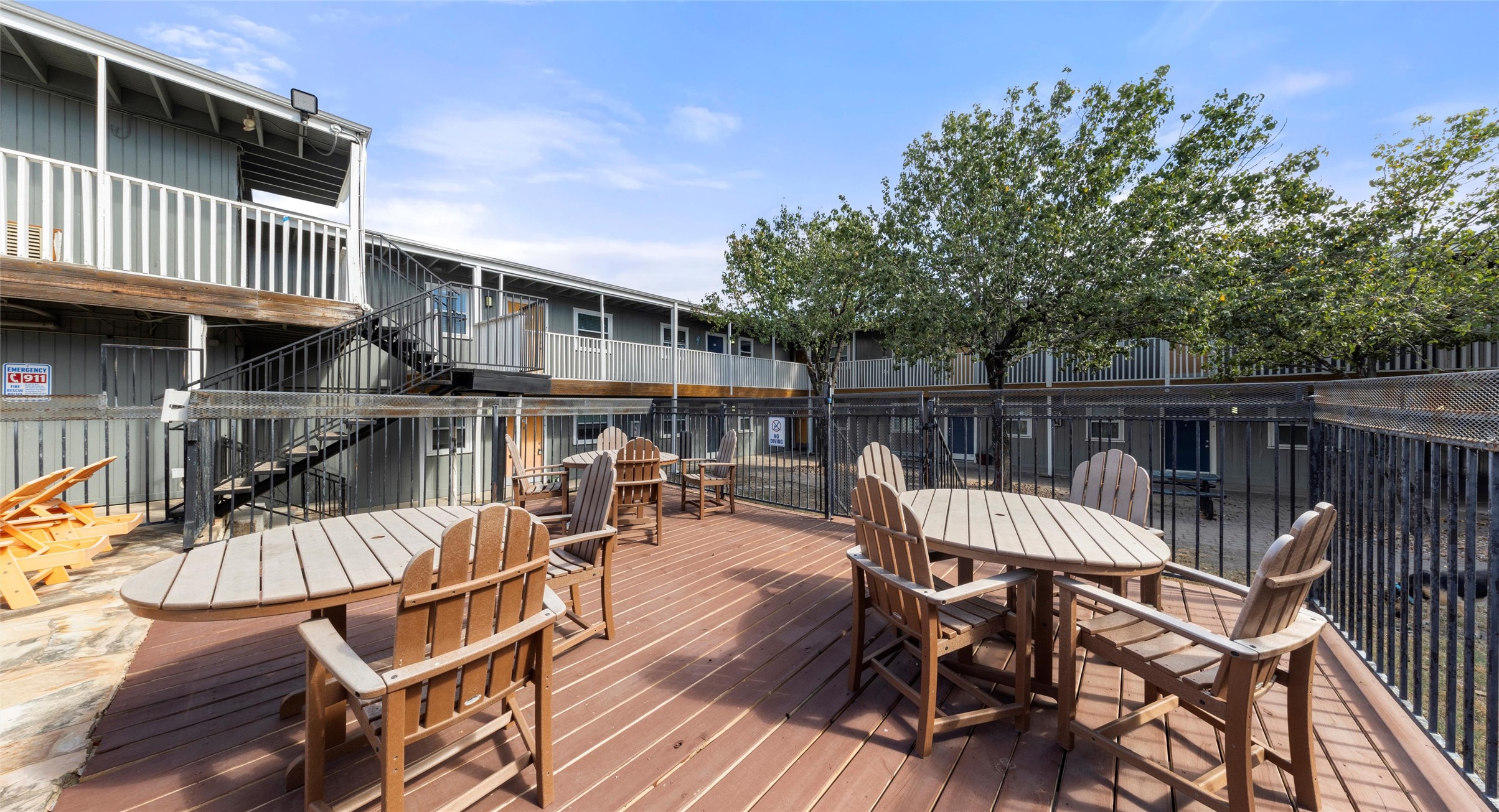 2401 Manor Road, Unit 123 Austin, TX 78722 - Photo 21 of 22 Relax and gather with friends on this inviting outdoor deck, featuring multiple seating areas.