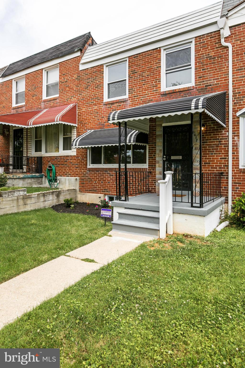 5417 Bucknell Road Baltimore, MD 21206 - Photo 2 of 30 a front view of a house with a yard table and chairs