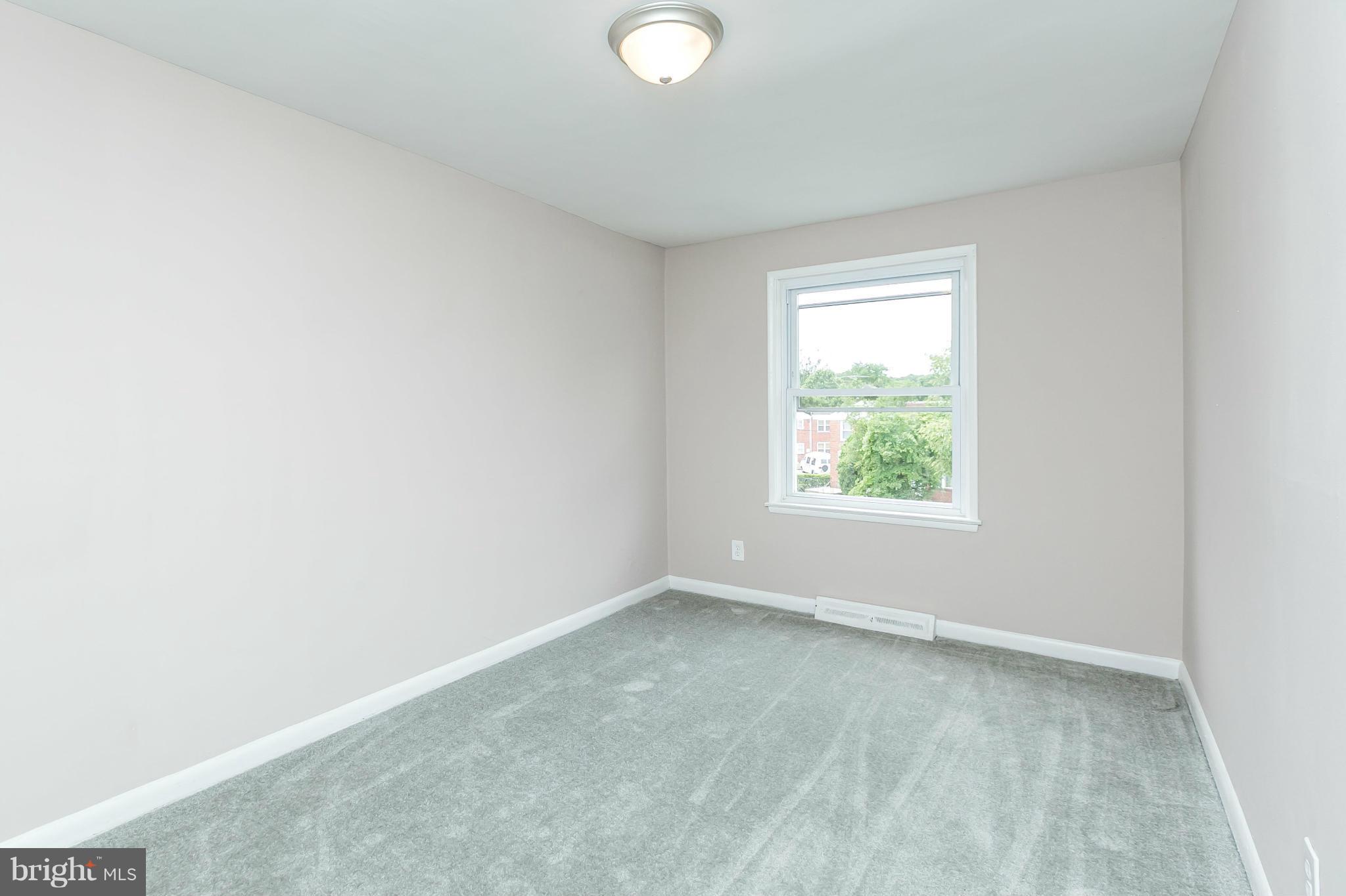 5417 Bucknell Road Baltimore, MD 21206 - Photo 17 of 30 an empty room with windows