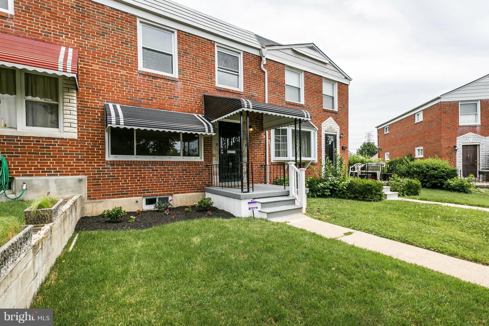 5417 Bucknell Road Baltimore, MD 21206 - Photo 3 of 30 a front view of a house with a yard