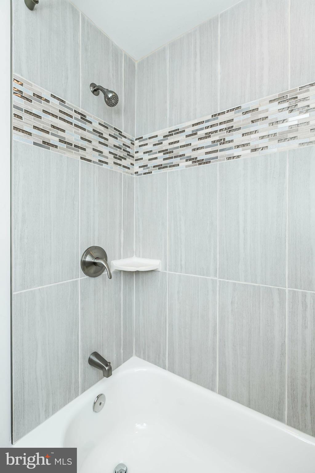 5417 Bucknell Road Baltimore, MD 21206 - Photo 23 of 30 a bathroom with a shower and a sink