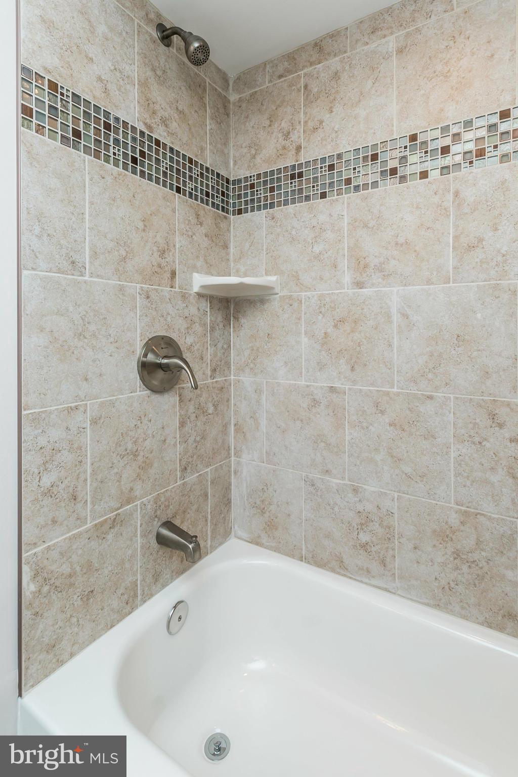 5417 Bucknell Road Baltimore, MD 21206 - Photo 27 of 30 a bathroom with a shower and a bathtub