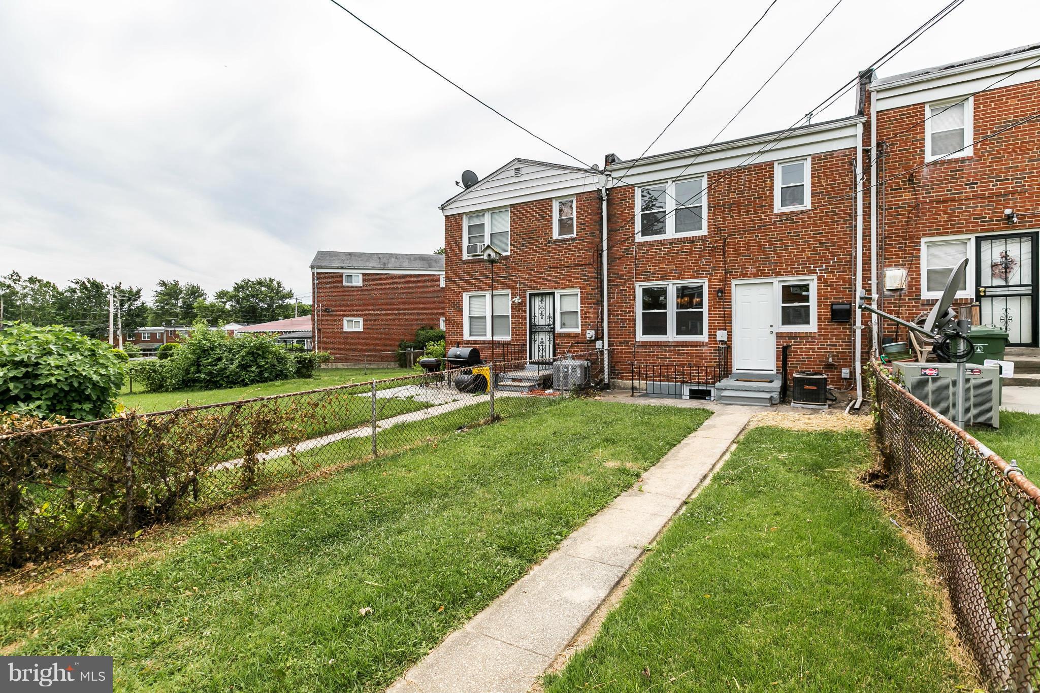 5417 Bucknell Road Baltimore, MD 21206 - Photo 30 of 30 a front view of a house with a yard table and chairs