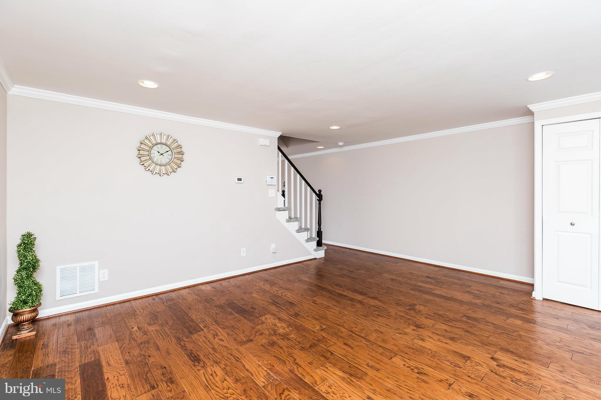 5417 Bucknell Road Baltimore, MD 21206 - Photo 7 of 30 a view of an empty room with wooden floor