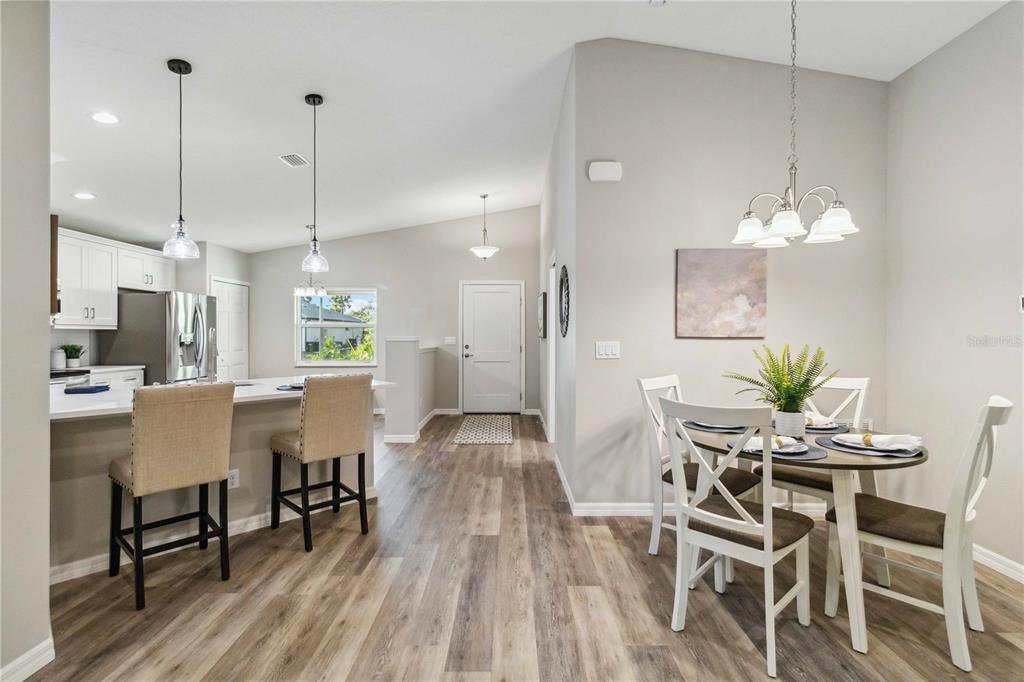 6288 Deer Run Road North Port, FL 34291 - Photo 12 of 43 a view of a dining room with furniture and wooden floor