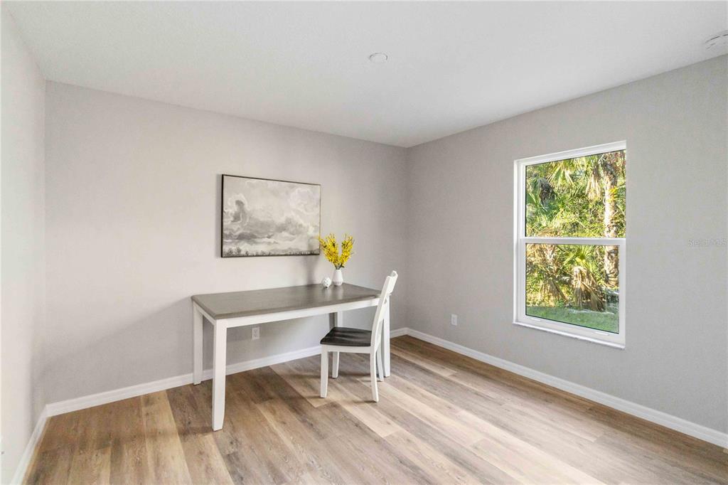 6288 Deer Run Road North Port, FL 34291 - Photo 30 of 43 a workspace with wooden floor and a window