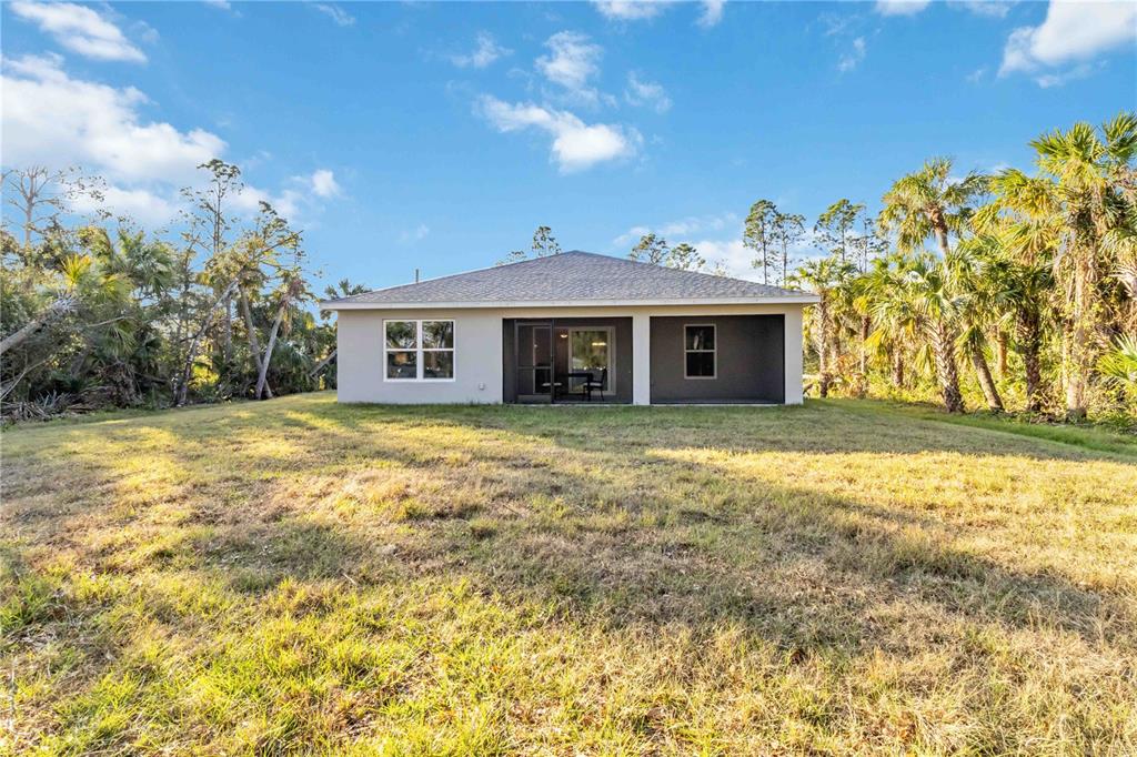 6288 Deer Run Road North Port, FL 34291 - Photo 39 of 43 a front view of a house with a garden