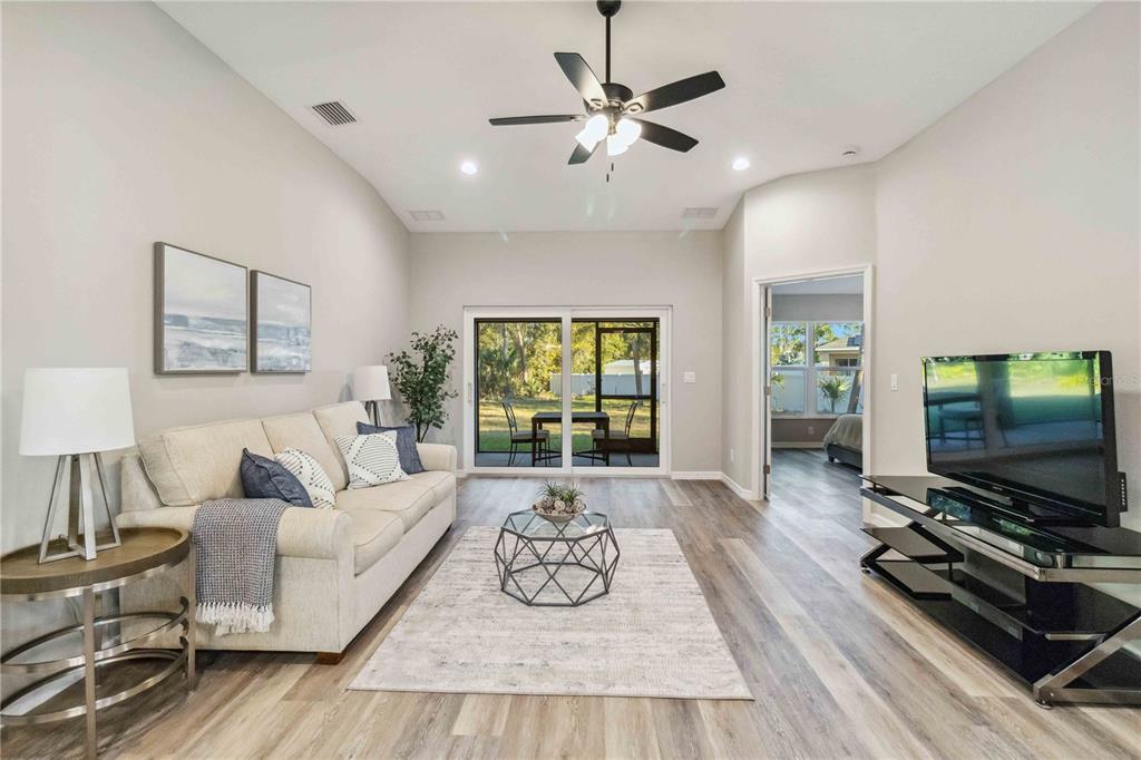 6288 Deer Run Road North Port, FL 34291 - Photo 5 of 43 a living room with furniture and a flat screen tv