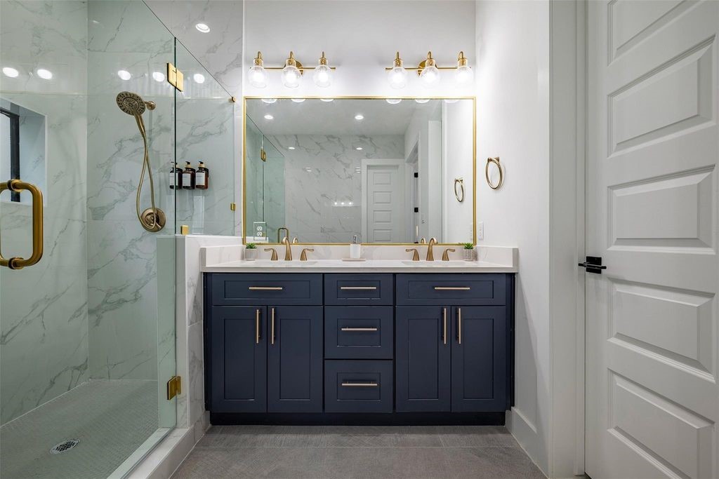 1305 East 27th Street, Unit B Houston, TX 77009 - Photo 14 of 27 a bathroom with a double vanity sink mirror and shower