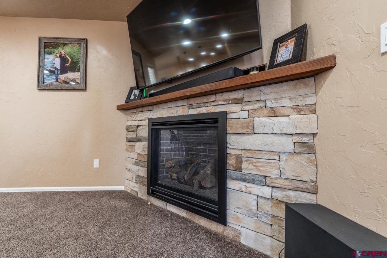 1265 H25 Road Delta, CO 81416 - Photo 12 of 34 a kitchen with a refrigerator and cabinets