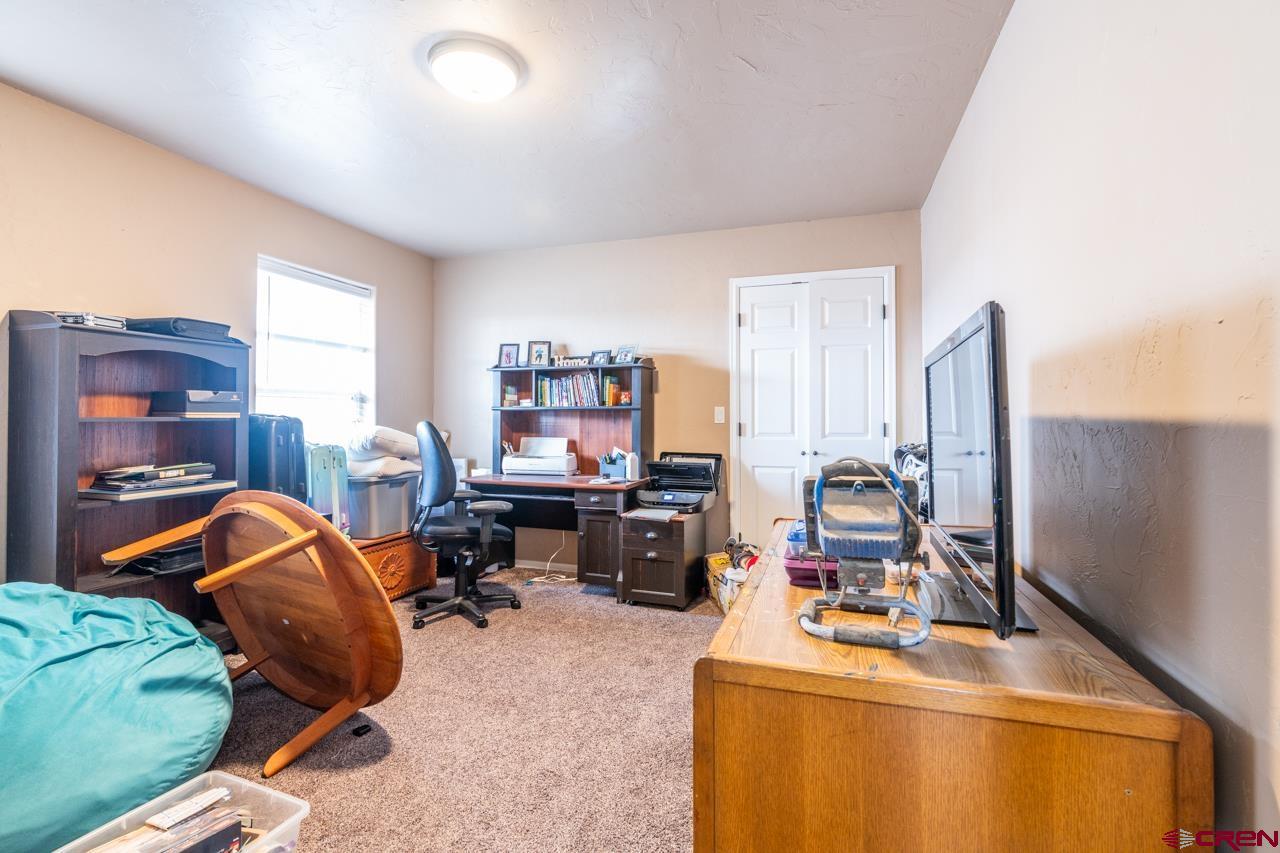 1265 H25 Road Delta, CO 81416 - Photo 13 of 34 a room with furniture and gym equipment