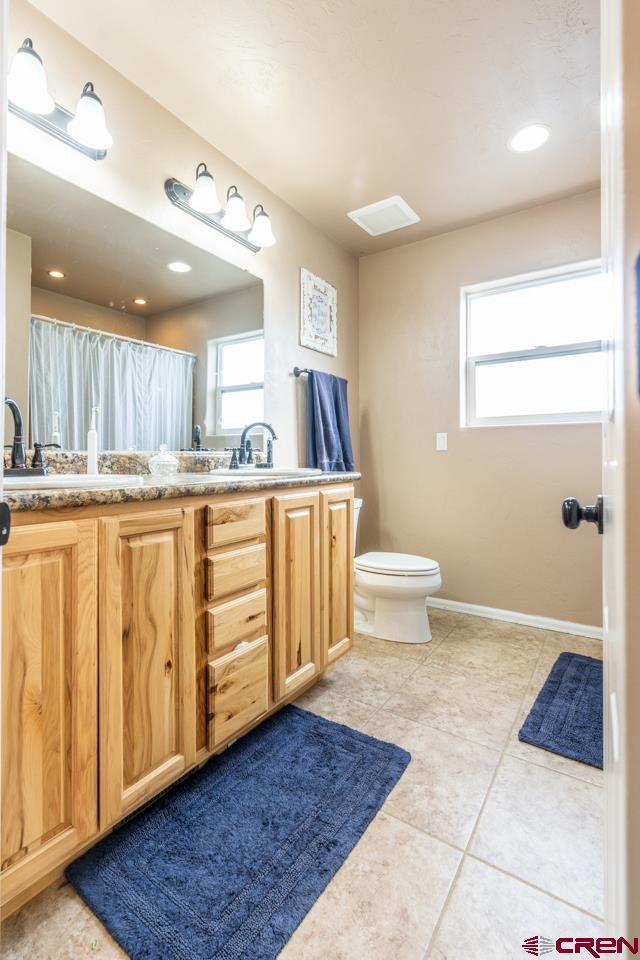 1265 H25 Road Delta, CO 81416 - Photo 16 of 34 a kitchen with stainless steel appliances granite countertop a sink and cabinets