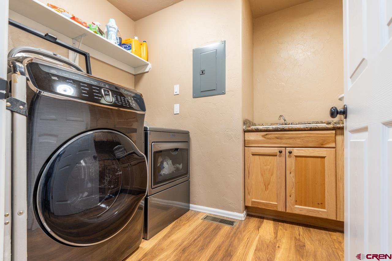 1265 H25 Road Delta, CO 81416 - Photo 25 of 34 a utility room with dryer and washer