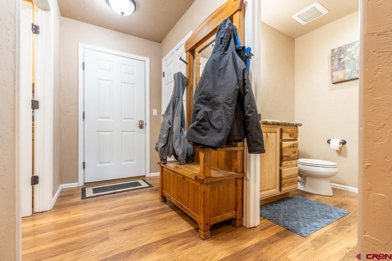 1265 H25 Road Delta, CO 81416 - Photo 26 of 34 a view of a bedroom with wooden floor and furniture