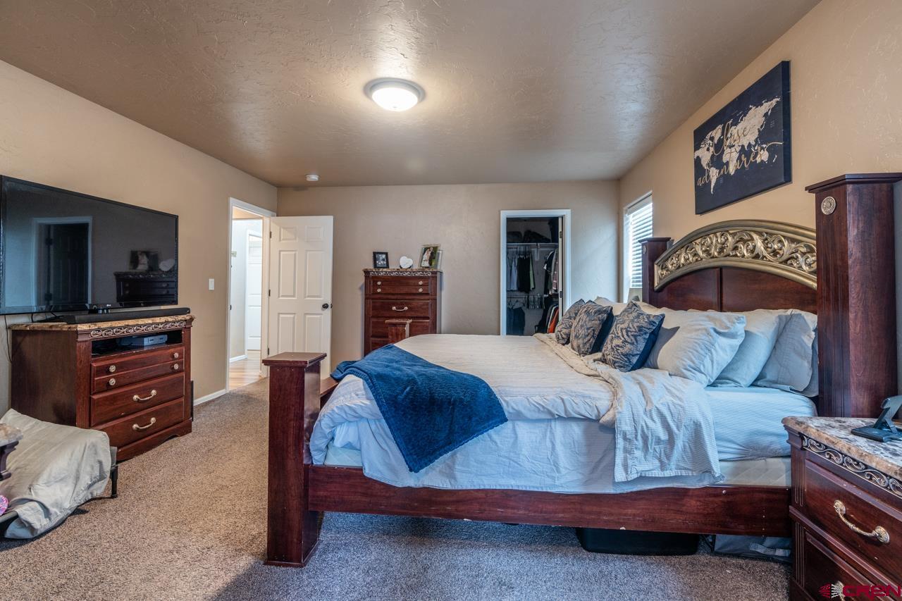 1265 H25 Road Delta, CO 81416 - Photo 29 of 34 a bedroom with a bed and a tv