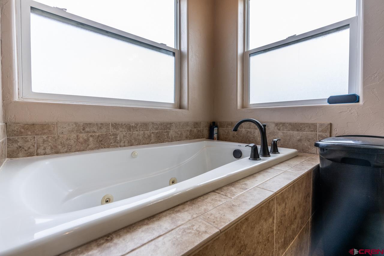 1265 H25 Road Delta, CO 81416 - Photo 34 of 34 a bathroom with a bathtub and a sink
