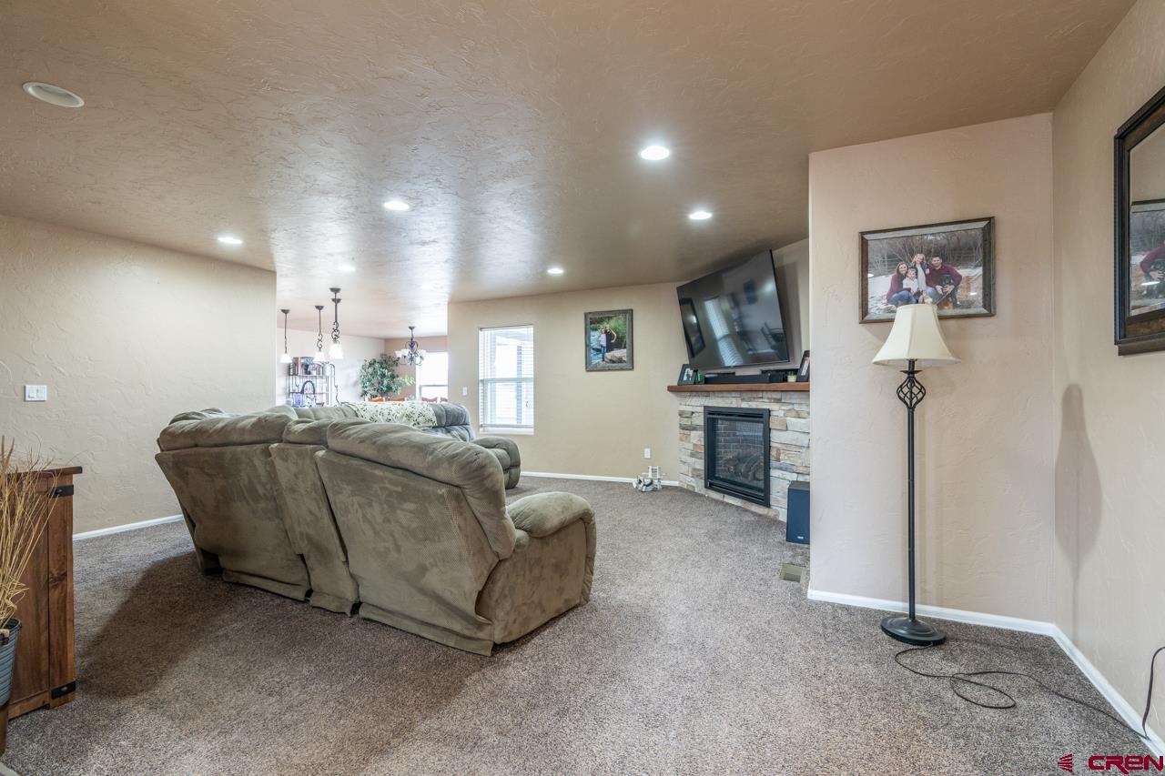 1265 H25 Road Delta, CO 81416 - Photo 7 of 34 a living room with furniture and a kitchen