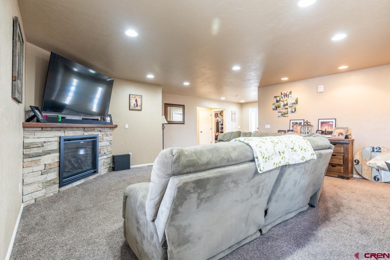 1265 H25 Road Delta, CO 81416 - Photo 10 of 34 a living room with furniture and a flat screen tv