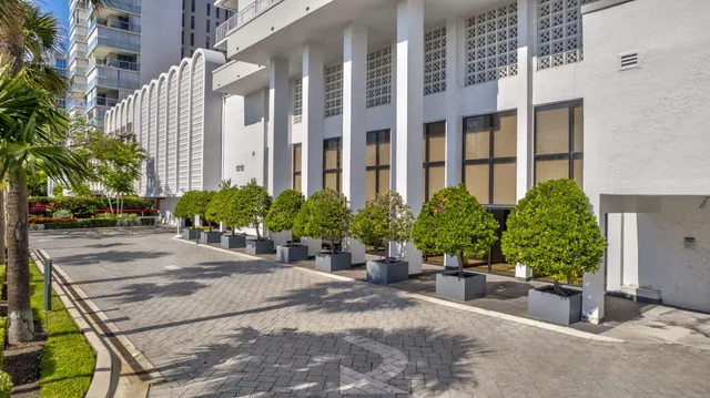 a view of a building with potted plants