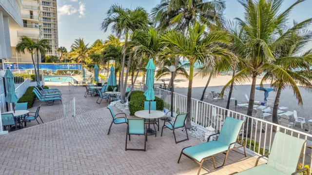 a view of a chairs and table in patio