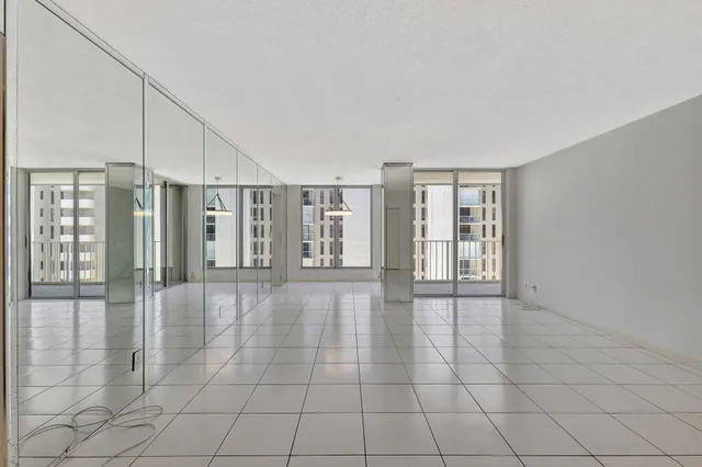 a view of an empty room with glass door