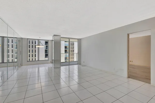 a view of an empty room with windows