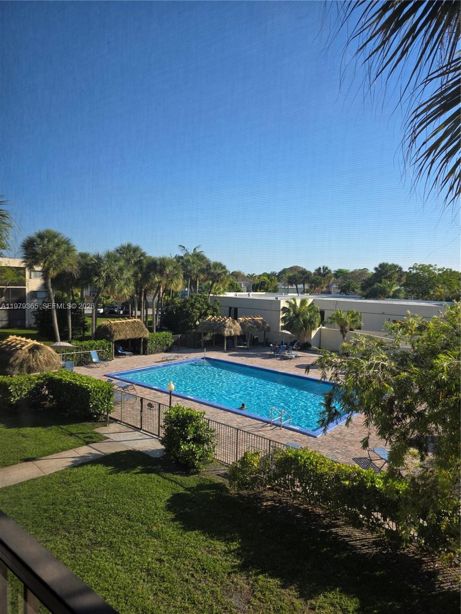 8015 Southwest 107th Avenue, Unit 313 Miami, FL 33173 - Photo 1 of 43 a view of a lake with houses