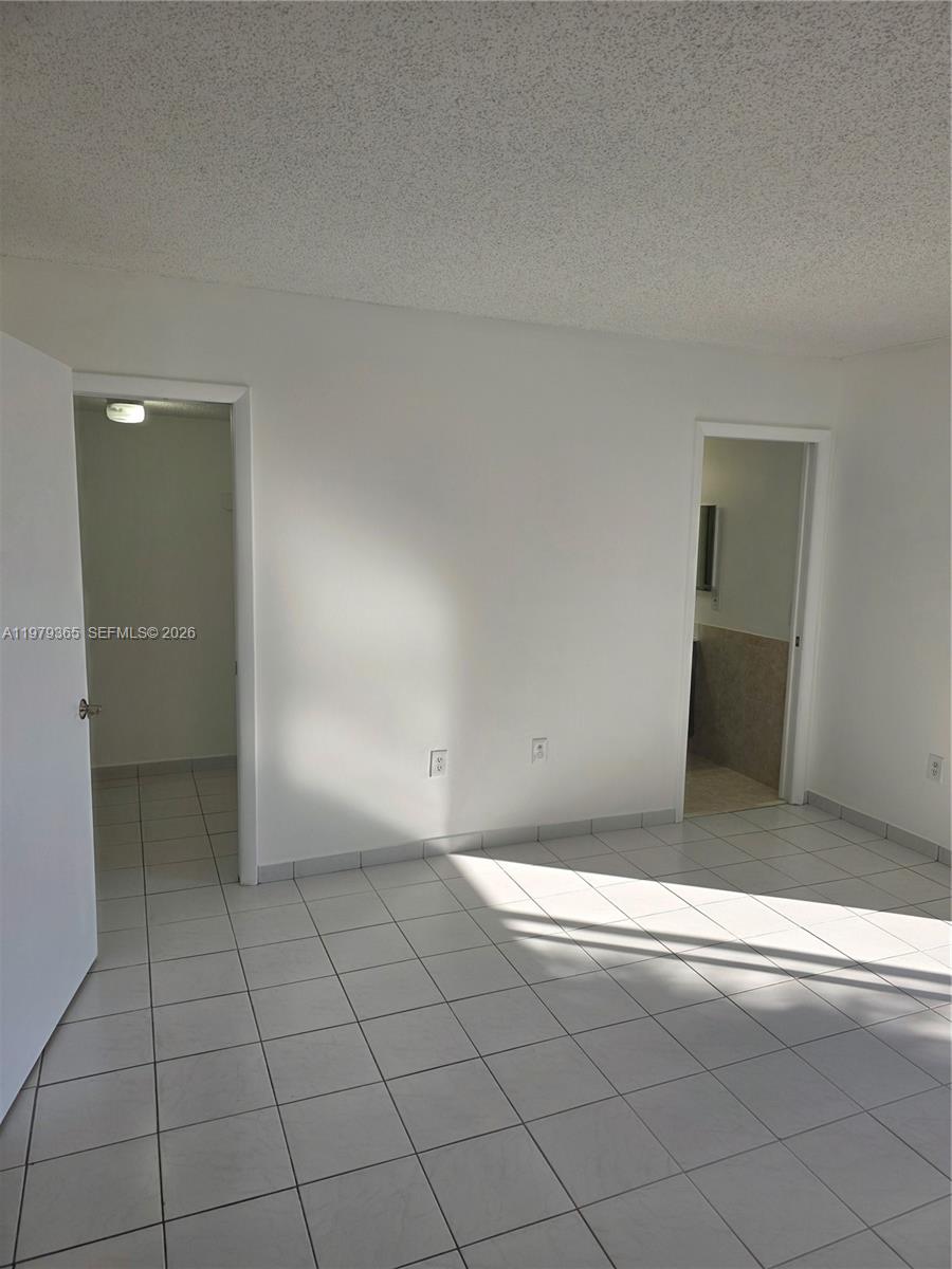 8015 Southwest 107th Avenue, Unit 313 Miami, FL 33173 - Photo 21 of 43 an empty room with windows