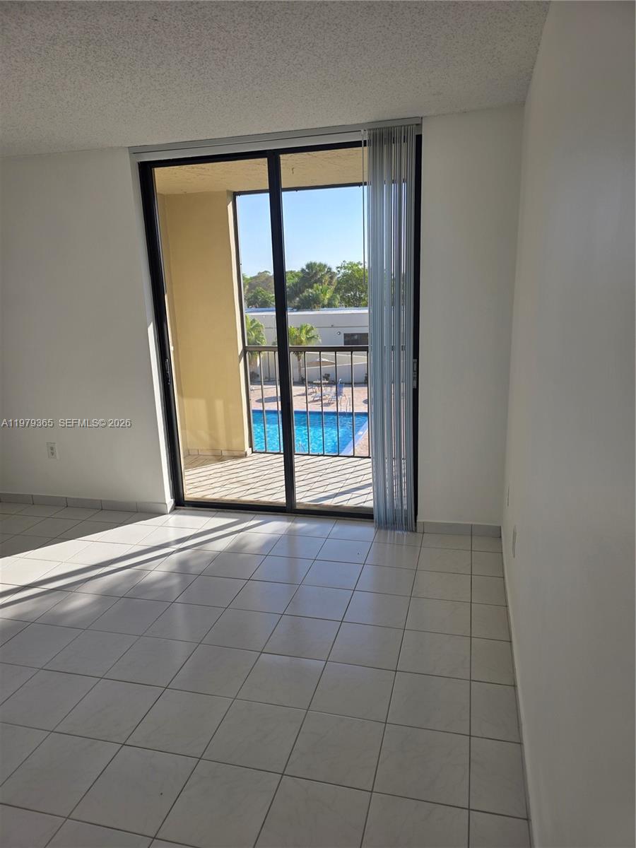 8015 Southwest 107th Avenue, Unit 313 Miami, FL 33173 - Photo 23 of 43 an empty room with windows
