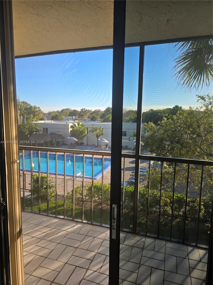 8015 Southwest 107th Avenue, Unit 313 Miami, FL 33173 - Photo 32 of 43 TILED BALCONY & WITH SHUTTERS