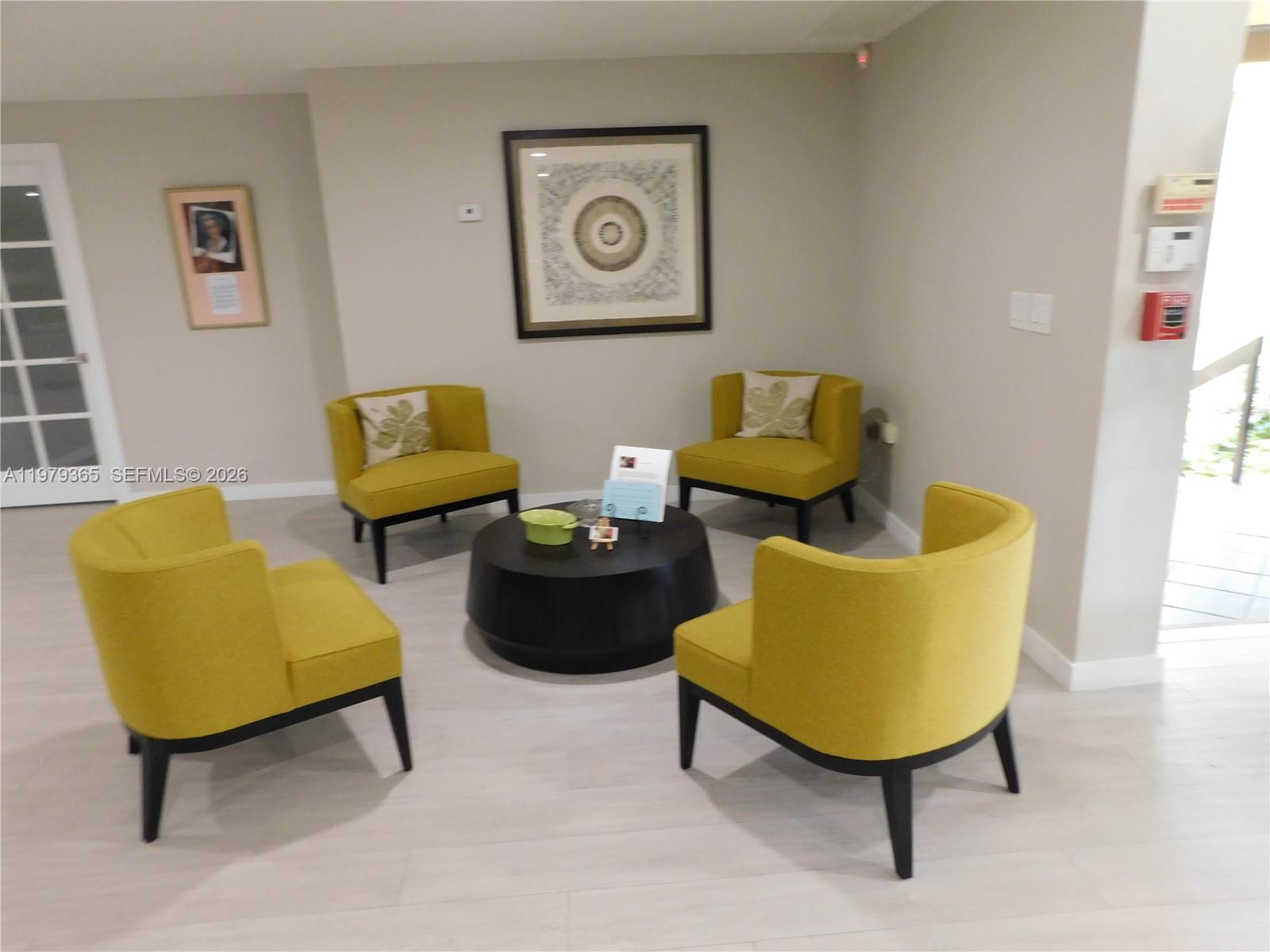 8015 Southwest 107th Avenue, Unit 313 Miami, FL 33173 - Photo 36 of 43 a living room with furniture and a rug