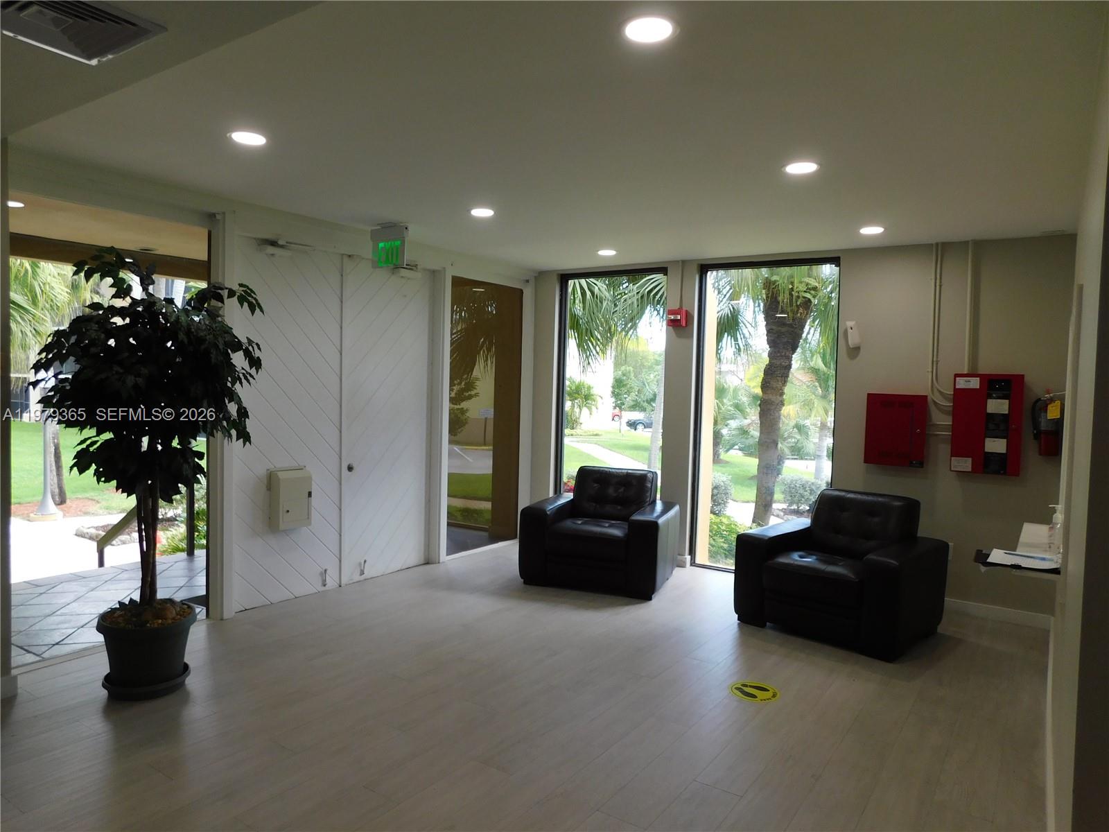 8015 Southwest 107th Avenue, Unit 313 Miami, FL 33173 - Photo 39 of 43 a living room with furniture and a large window