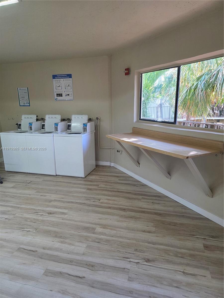 8015 Southwest 107th Avenue, Unit 313 Miami, FL 33173 - Photo 42 of 43 a living room with furniture and a large window